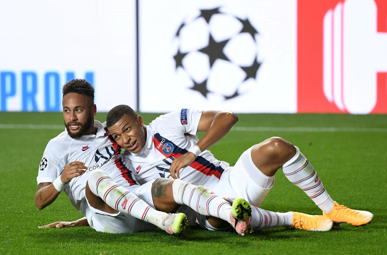 Soccer Football - Champions League - Quarter Final - Atalanta v Paris St Germain - Estadio da Luz, Lisbon, Portugal - August 12, 2020  Paris St Germain's Neymar and Kylian Mbappe celebrate their second goal, as play resumes behind closed doors following the outbreak of the coronavirus disease (COVID-19)  David Ramos/Pool via REUTERS     TPX IMAGES OF THE DAY