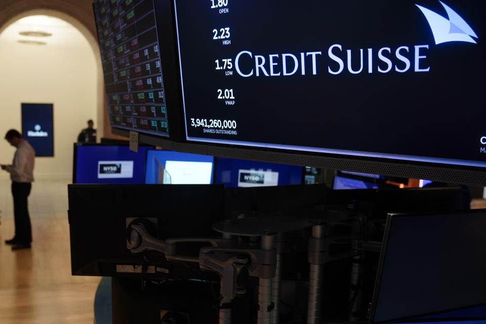 A sign displays the name of Credit Suisse on the floor at the New York Stock Exchange in New York, Wednesday, March 15, 2023. (AP Photo/Seth Wenig)