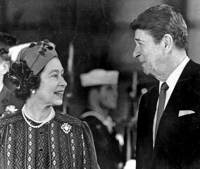 March 1, 1983: Queen Elizabeth II and President Ronald Reagan chat at Santa Barbara airport before a visit to the Reagans' hilltop ranch. This photo was published in the March 2, 1983, Los Angeles Times. (George Rose / Los Angeles Times)