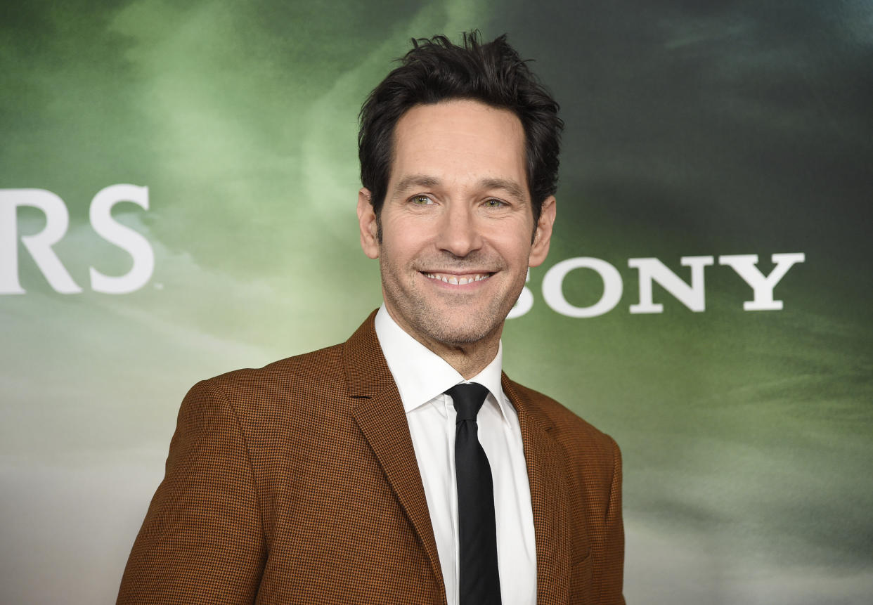 FILE - Paul Rudd attends the premiere of "Ghostbusters: Afterlife" at AMC Lincoln Square 13 Nov. 15, 2021, in New York. People’s Sexiest Man Alive of 2021 is set to be inducted into the vaunted Five-Timers Club on “Saturday Night Live,” but the surging omicron variant of the coronavirus means there won’t be a live audience to see it happen. The show announced on social media Saturday, Dec. 18, that the night’s episode would tape without a live audience and with only limited cast and crew. “Ant-Man” star Rudd is the host and British pop star Charli XCX is the night’s musical guest. (Photo by Evan Agostini/Invision/AP, File)