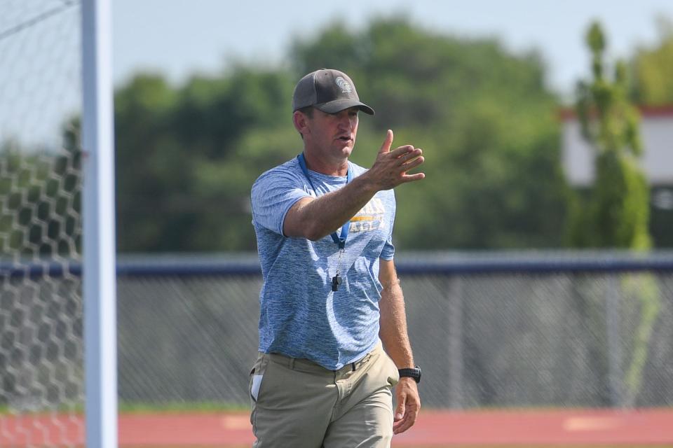 O'Gorman football coach Jayson Poppinga talking to players during practice at O'Gorman High School in Sioux Falls, South Dakota on Wednesday, August 16, 2023.