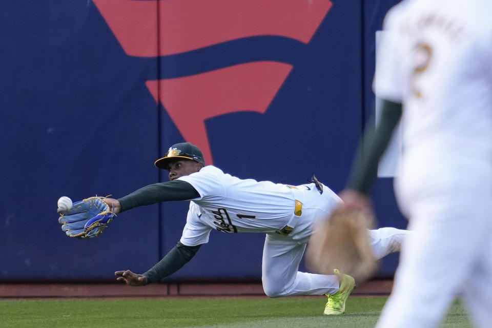 Oakland Athletics left fielder Esteury Ruiz catches a flyout hit by Miami Marlins' Bryan De La Cruz during the sixth inning of a baseball game Saturday, May 4, 2024, in Oakland, Calif. (AP Photo/Godofredo A. Vásquez)