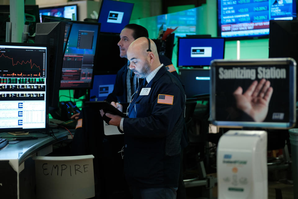 NEW YORK, NEW YORK - MARCH 17: Traders work on the floor of the New York Stock Exchange (NYSE) on March 17, 2020 in New York City. The Dow was up slightly in morning trading following a day that saw one of the worst drops in the market's history as America and the world react to the spreading of the coronavirus.  (Photo by Spencer Platt/Getty Images)