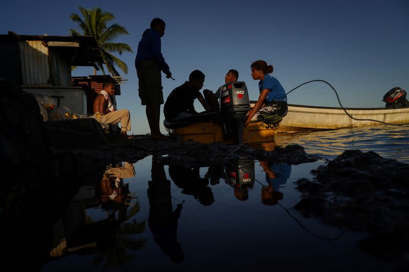 The Wider Image: Rising sea levels are forcing Fiji's villagers to relocate. They want polluters to pay instead