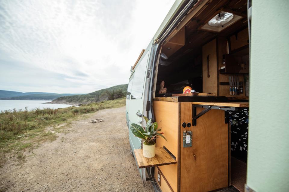 A view of the outside of the van with the door open