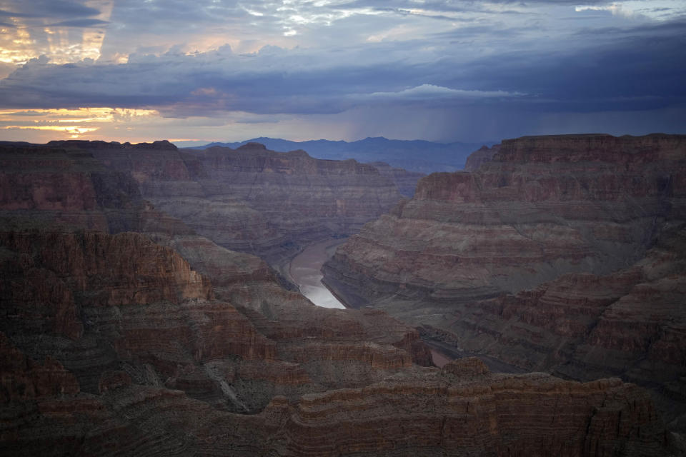 FILE - The Colorado River flows through the Grand Canyon on the Hualapai reservation on Aug. 15, 2022, in northwestern Arizona. The federal government is expected to make an announcement on Tuesday, Aug. 15, 2023, about the health of the Colorado River and water cuts in 2024. (AP Photo/John Locher, File)