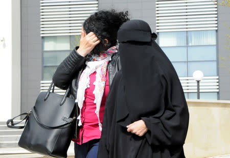 A woman repatriated to Kosovo from Syria leaves the Basic Court in Pristina, Kosovo, April 23, 2019. REUTERS/Laura Hasani