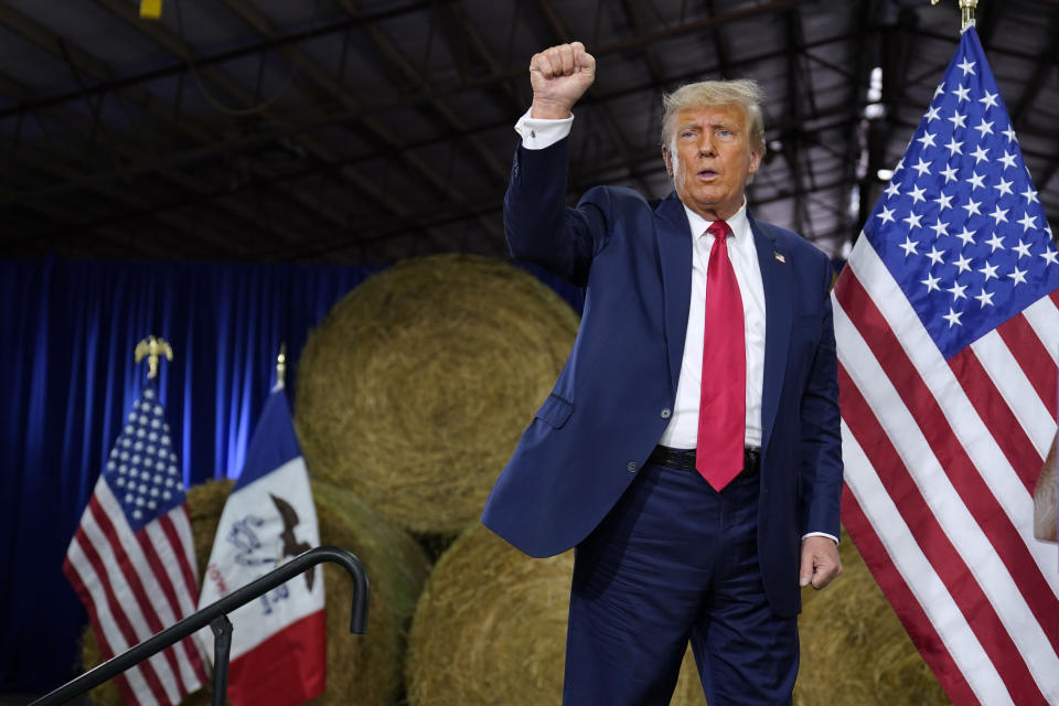 Former President Donald Trump reacts after a commit to caucus rally, Monday, Oct. 16, 2023, in Adel, Iowa. (AP Photo/Charlie Neibergall)