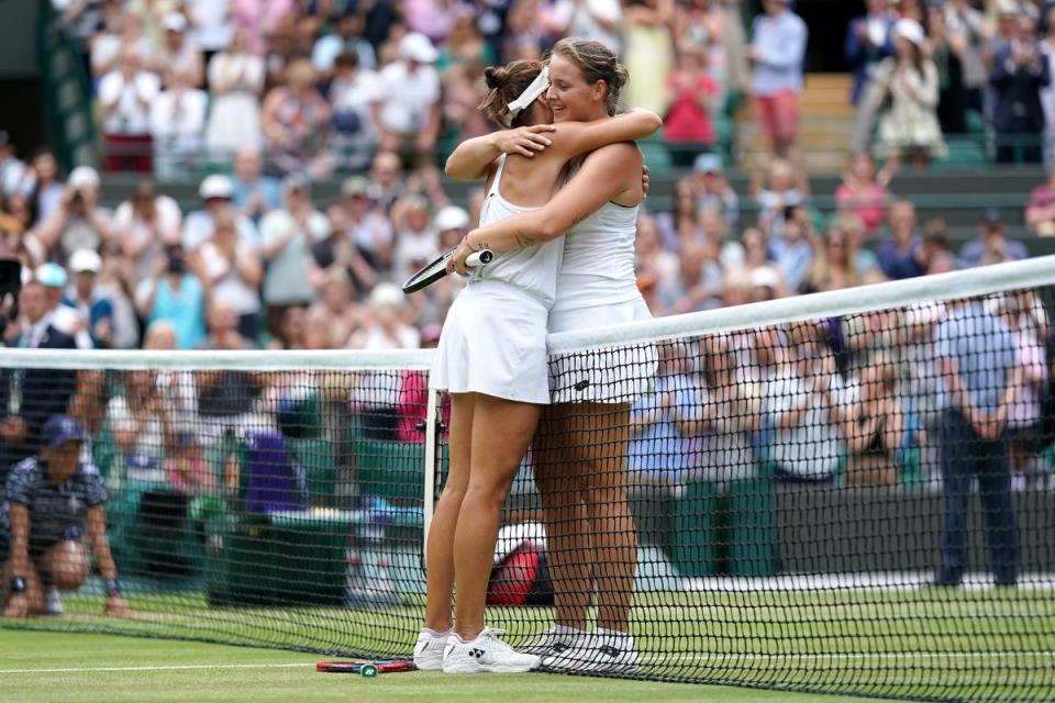 Germany’s Tatjana Maria shared a long hug with compatriot Jule Niemeier after they produced an epic back and forth quarter-final tie on Court One (Zac Goodwin/PA) (PA Wire)