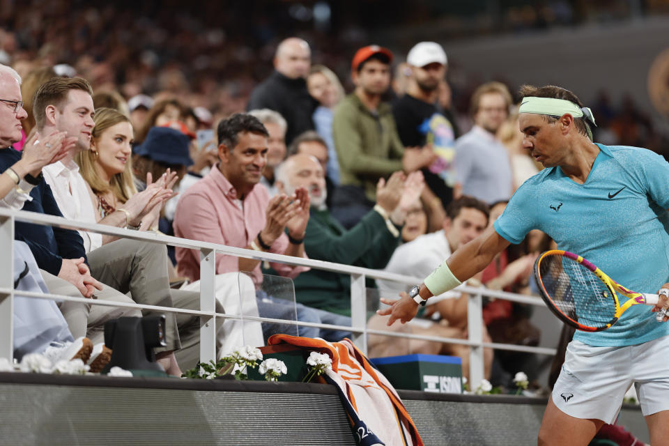 Spectators applaud for Spain's Rafael Nadal during his first round match of the French Open tennis tournament against Germany's Alexander Zverev at the Roland Garros stadium in Paris, Monday, May 27, 2024. (AP Photo/Jean-Francois Badias)