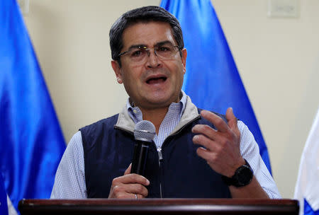 Honduras President and National Party candidate Juan Orlando Hernandez gestures as he addresses the media at the Presidential House in Tegucigalpa, Honduras December 5, 2017. REUTERS/Jorge Cabrera