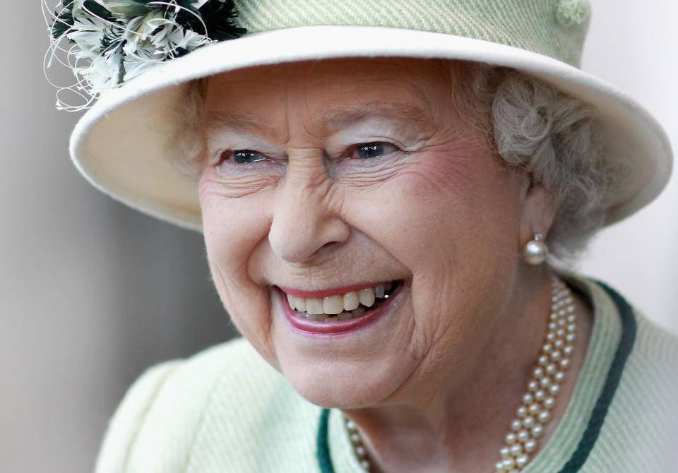 Queen Elizabeth II smiles as she visits Palm Paper on February 2, 2011 in Norwich, England. The Queen and Duke of Edinburgh are visiting sites today, which include the Palm Paper mill and West Norfolk Deaf Association in King's Lynn.  (Photo by Chris Jackson - WPA Pool/Getty Images)