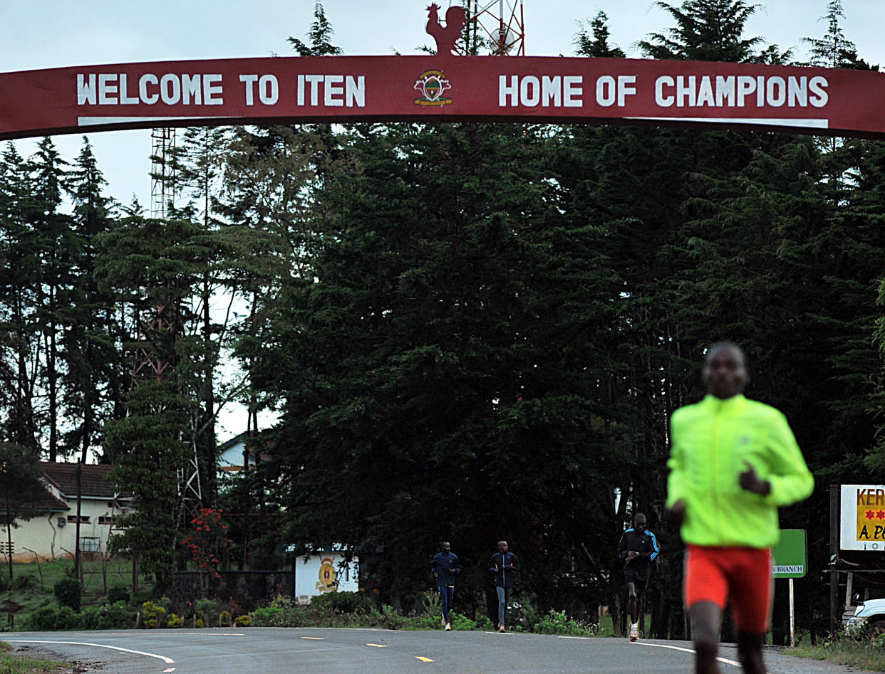 TO GO WITH AFP STORY BY Aileen Kimutai
Kenyan atheletes run during a training session on December 2, 2011 at the high-altitude town of Iten in Kenya's north-rift. It's a dilemma that other nations can only eye with envy: Kenya simply has too many top athletes chasing the final spot on its revered men's Olympic marathon team.  With Kenya's marathon runners making an unprecedented clean sweep of all six major races in 2011, selectors face the major headache of choosing the last remaining man to represent the country at the 2012 Olympic Games in London. AFP PHOTO/Tony KARUMBA (Photo credit should read TONY KARUMBA/AFP via Getty Images)