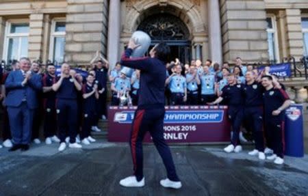 Britain Soccer Football - Burnley - Sky Bet Football League Championship Winners Parade - Burnley - 9/5/16 Burnley's Joey Barton celebrates with a blow up trophy after winning the Sky Bet Football League Action Images via Reuters / Carl Recine Livepic