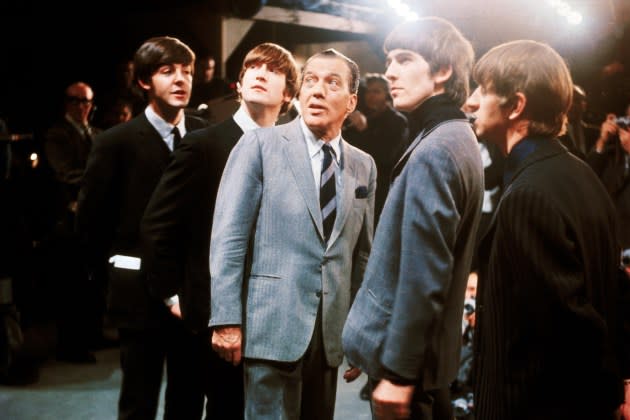 The Beatles with Ed Sullivan during the taping of their New York Debut show, 1964. - Credit: Bettmann Archive/Getty Images