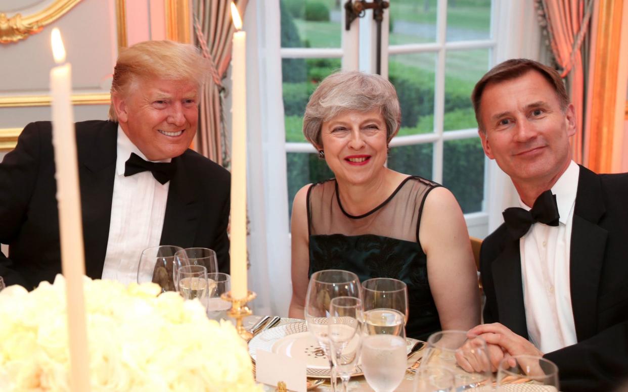 US President Donald Trump, Prime Minister Theresa May and Foreign Secretary Jeremy Hunt at the Return Dinner at Winfield House - PA