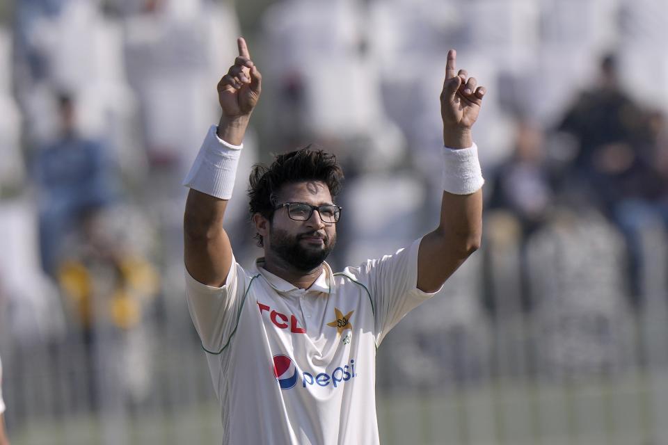 Pakistan's Imam-ul_Haq celebrates after scoring century during the third day of the first test cricket match between Pakistan and England, in Rawalpindi, Pakistan, Saturday, Dec. 3, 2022. (AP Photo/Anjum Naveed)