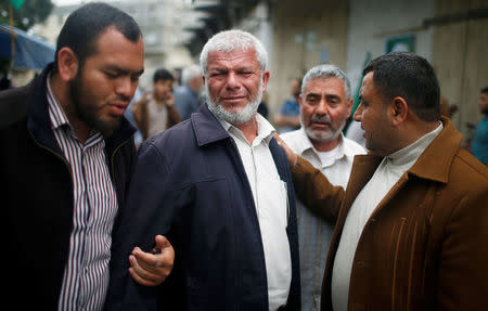 Relatives of a Palestinian electrical engineer Fadi al-Batash, who was shot to death in Malaysia, mourn outside his family house in the northern Gaza Strip April 21, 2018. REUTERS/Mohammed Salem