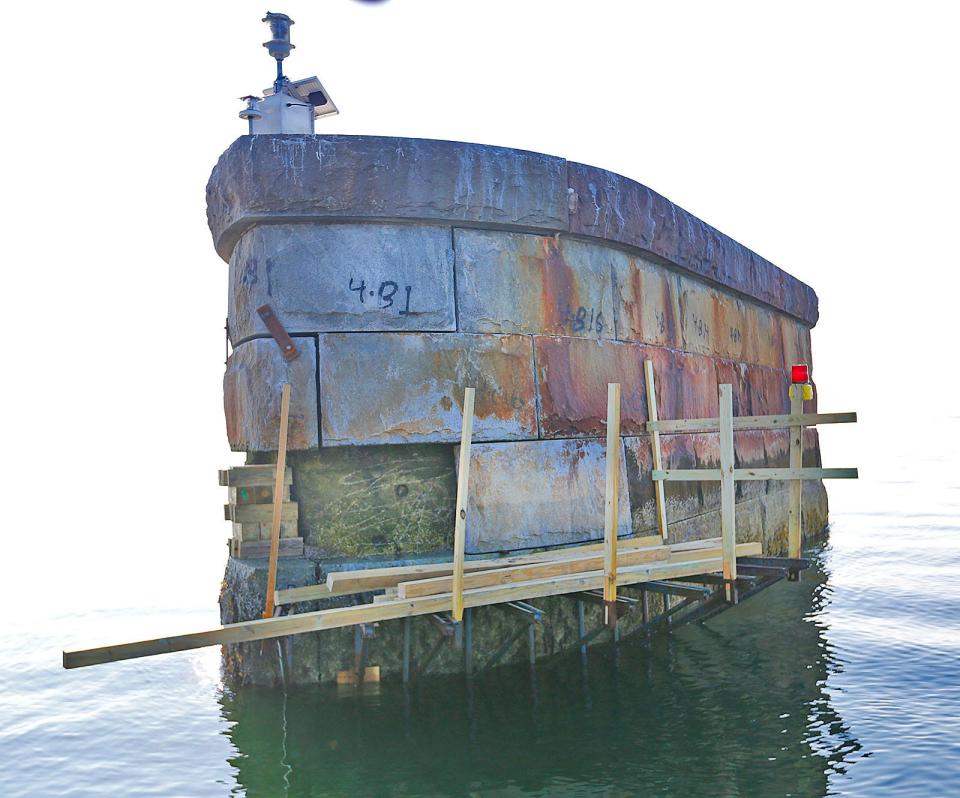 One of the Long Island Bridge piers has a few missing blocks.