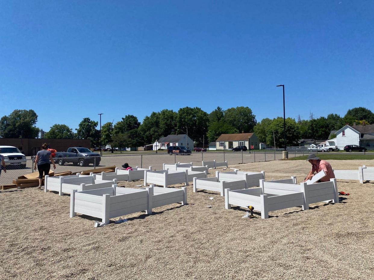 Volunteers helped build raised garden beds for the Mt. Logan Community Garden.