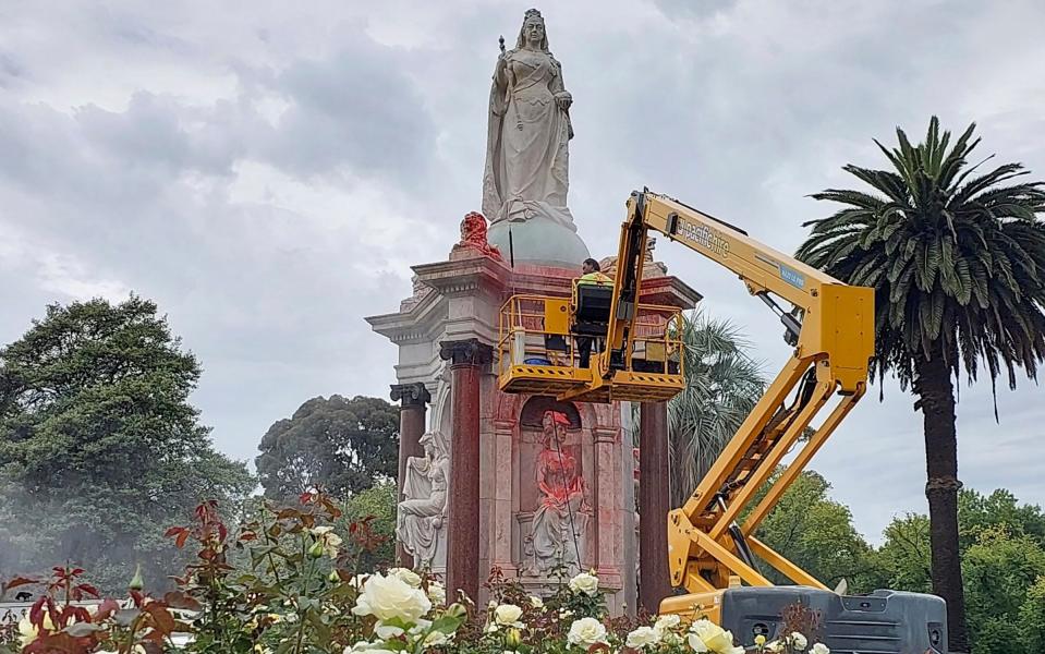 A council worker cleaning the statue on Thursday