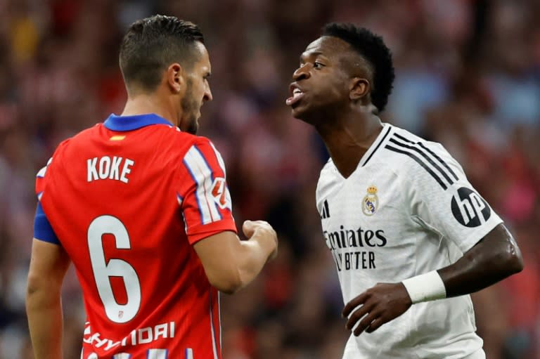 Real Madrid forward Vinicius Junior (R) is hoping to win the Ballon d'Or at the end of October (OSCAR DEL POZO)