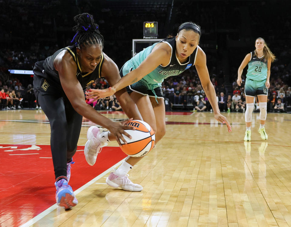 LAS VEGAS, NEVADA - AUGUST 17: Chelsea Gray #12 of the Las Vegas Aces and Betnijah Laney #44 of the New York Liberty go after a loose ball in the second quarter of their game at Michelob ULTRA Arena on August 17, 2023 in Las Vegas, Nevada. NOTE TO USER: User expressly acknowledges and agrees that, by downloading and or using this photograph, User is consenting to the terms and conditions of the Getty Images License Agreement. (Photo by Ethan Miller/Getty Images)