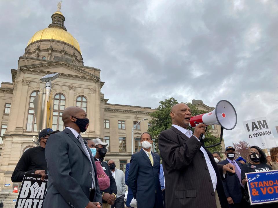 African Methodist Episcopal Church Bishop Reginald Jackson announces a boycott of Coca-Cola Co. products outside the Georgia Capitol on Thursday, March 25, 2021 in Atlanta.  Jackson says Coca-Cola and other large Georgia companies haven't done enough to oppose restrictive voting bills that Georgia lawmakers were debating as Jackson spoke (AP Photo/Jeff Amy)