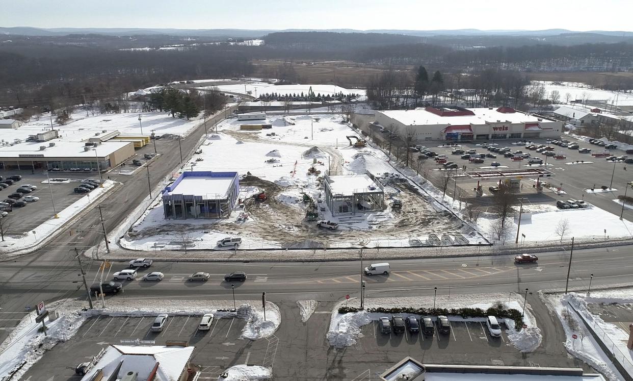 Aerial view of the site where a Panera Bread, Starbucks and Chipotle, as well as a housing project are being built at the intersection of South Park Drive and Water Street in Newton. Photographed on Wednesday, Jan. 19, 2022.