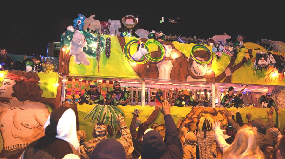 Riders toss beads and other trinkets to the crowd as the Krewe of Hercules parades through Houma in 2020. The krewe will kick off the Houma-Thibodaux area's 2022 Mardi Gras parade season Feb. 18.