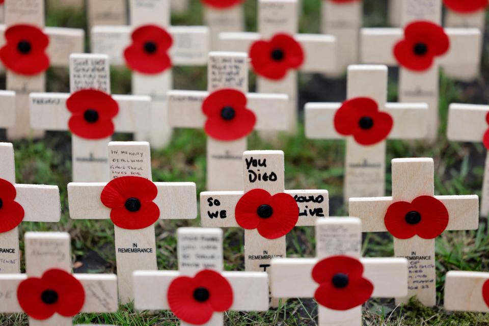 Rows of crosses with poppies are laid out on Nov. 8, 2021, to make a field of Remembrance beside Westminster Abbey in preparation for Remembrance Sunday in London.