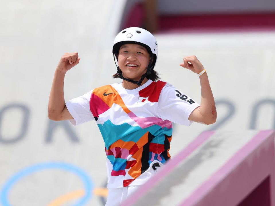 Momiji Nishiya flexes during the Tokyo Olympics.