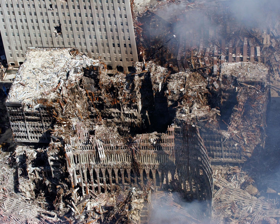 An aerial view shows only a small portion of the crime scene where the World Trade Center collapsed following the Sept. 11 terrorist attack.  Surrounding buildings were heavily damaged by the debris and massive force of the falling twin towers. (Photo Credit: U.S. Navy/Eric J. Tilford)