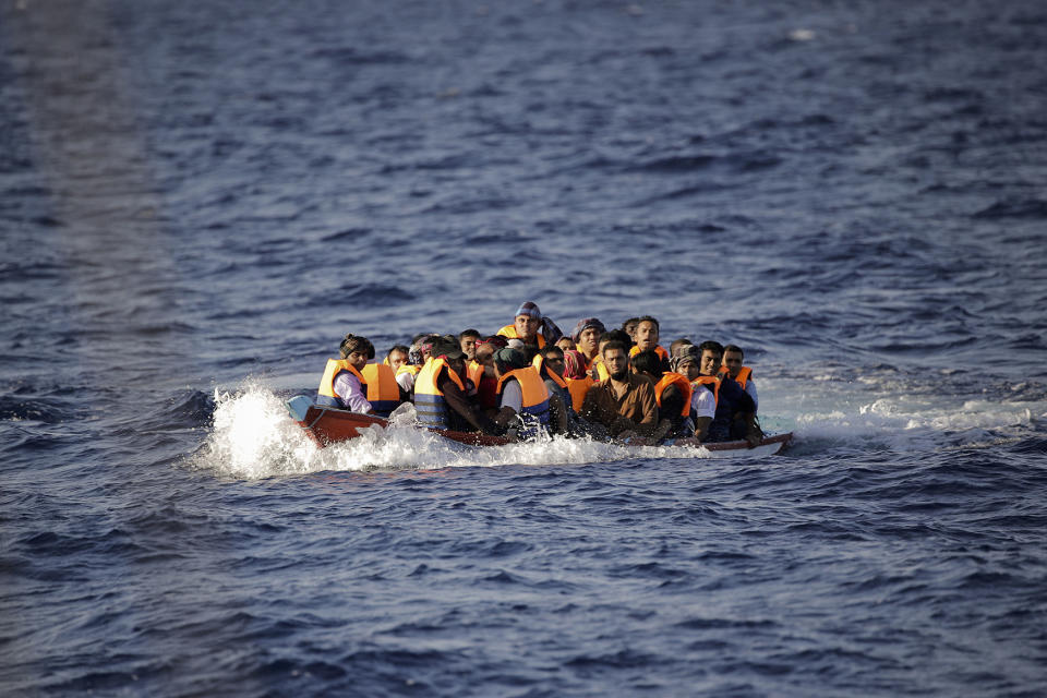 Migrants and refugees fleeing in a dinghy