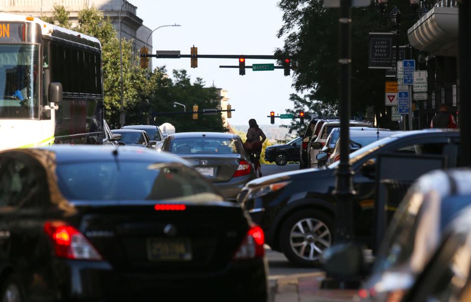 Traffic and pedestrians mix on 10th Street near Rodney Square in downtown Wilmington, Tuesday, Sept. 19, 2023.