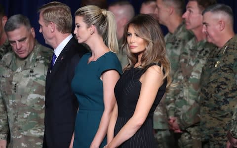 First lady Melania Trump stands with Ivanka Trump before President Donald Trump delivered remarks on American involvement in Afghanistan at the Fort Myer military base on August 21, 2017 in Arlington, Virginia - Credit: Getty