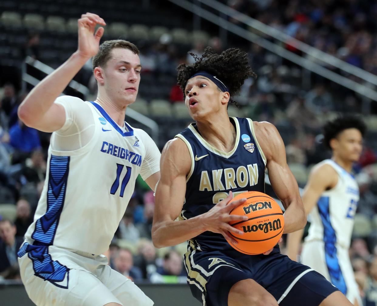 Akron's Enrique Freeman (25) drives against Creighton's Ryan Kalkbrenner (11) during the first half of an NCAA Tournament first-round game. Freeman will be participating in the NBA Combine this week in Chicago.