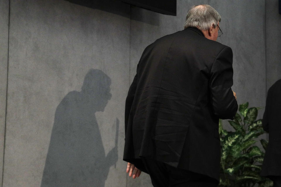 FILE - In this June 29, 2017, file photo, Cardinal George Pell leaves after meeting the media at the Vatican. Cardinal George Pell was sentenced in an Australian court on Wednesday, March 13, 2019 to 6 years in prison for molesting two choirboys in a Melbourne cathedral more than 20 years ago. (AP Photo/Gregorio Borgia, File)