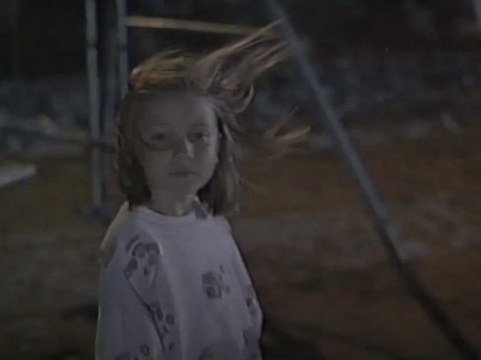 The Birds II: Land's End scene of young girl with hair flying in the wind