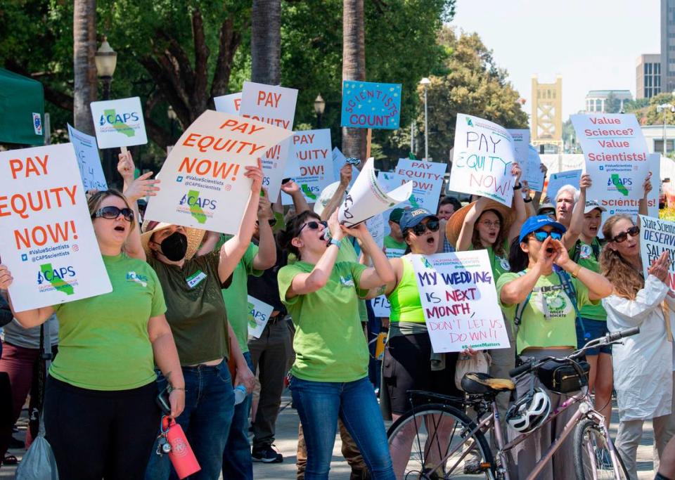 Members of the California Association of Professional Scientists rally for increased wages at the Capitol on Aug. 30. The union represents 5,300 scientists that work for the state of California. Its labor agreement expired in 2020, and the group maintains that salaries for its workers have lagged behind managers, supervisors and state engineers by 30%.