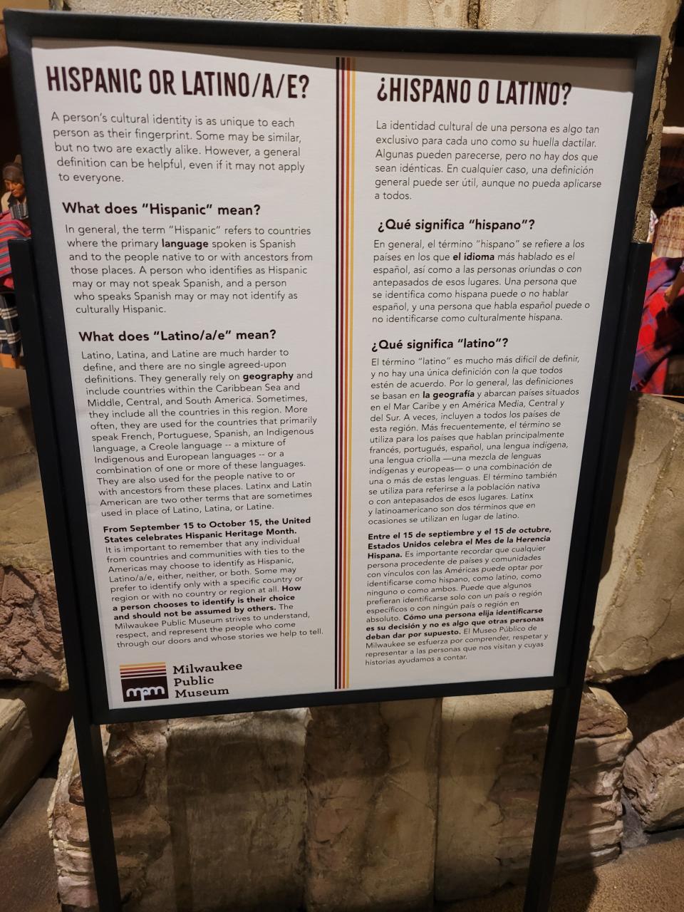 An education display at the Milwaukee Public Museum includes a sign that explains the definitions of Hispanic and Latino.