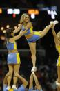 UCLA cheerleaders perform against the Florida during the first half in a regional semifinal game at the NCAA college basketball tournament, Thursday, March 27, 2014, in Memphis, Tenn. (AP Photo/John Bazemore)