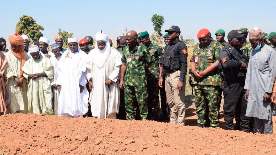 PHOTO: Nigeria Chief of Army Staff Lieutenant General Taoreed Lagbaja, center, with other Community leaders pray at the grave side were victims of an army drones attack were buried in Tudun Biri village Nigeria, Tuesday, Dec. 5, 2023. (Kehinde Gbenga/AP)