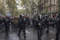 <p>Pro-Referendum supporters clash with members of the Spanish National Police, after police tried to enter a polling station to retrieve ballot boxes. (Getty) </p>