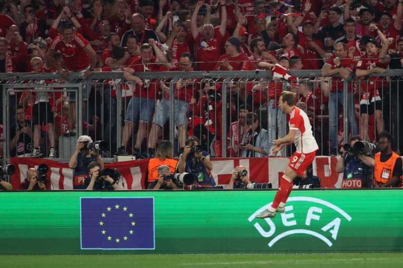 FC Bayern Munich's Harry Kane celebrates scoring his side's second goal during the UEFA Champions League semi-final first leg soccer match between Bayern Munich and Real Madrid at Allianz Arena. Matthias Balk/dpa
