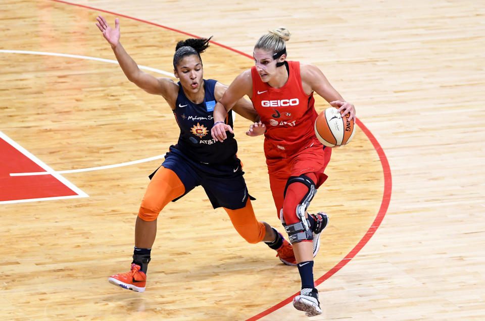 WASHINGTON, DC - OCTOBER 10:  Elena Delle Donne #11 of the Washington Mystics handles the ball against Alyssa Thomas #25 of the Connecticut Sun in Game 5 of the 2019 WNBA Finals at St Elizabeths East Entertainment & Sports Arena on October 10, 2019 in Washington, DC.  (Photo by G Fiume/Getty Images)