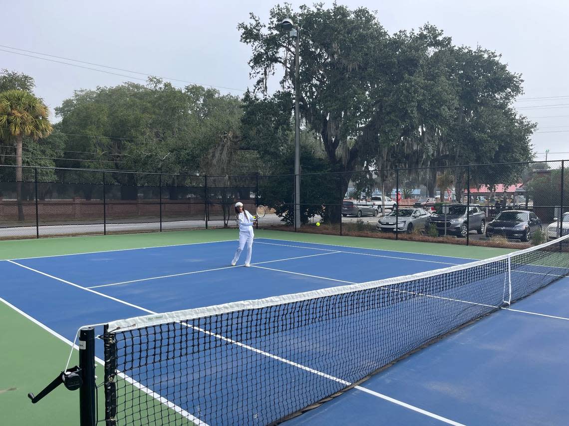 Coach Larry Scheper hits the first tennis balls at the Beaufort Tennis Center. The courts had been closed since April for renovations.