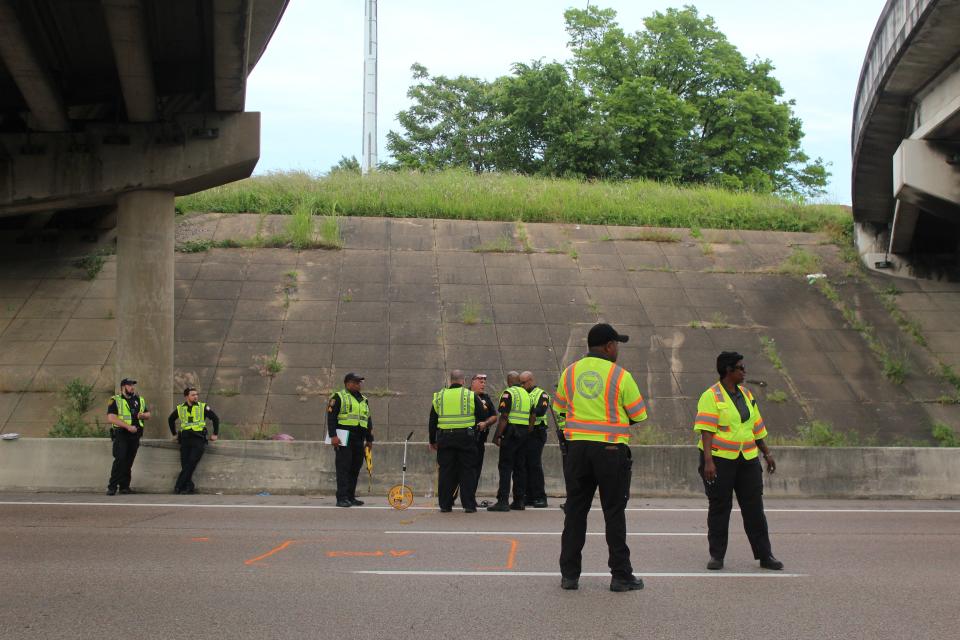 Tennessee Highway Incident Response Unit workers at the scene of a fatal pedestrian crash on I-240 and Union going northbound.
