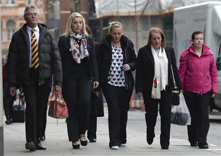 The family of murdered soldier Lee Rigby arrive at the Old Bailey in London, November 29, 2013. REUTERS/Neil Hall