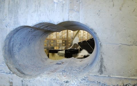 The gang drilled through the wall of the vault before making off with £14 million in gems, gold and cash - Credit: PA